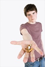 Angry man holding crumpled cigarette