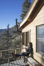 Caucasian woman admiring view from cabin deck