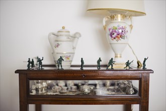 Toy soldiers on antique hutch