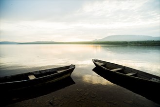 Dilapidated boats at remote lake