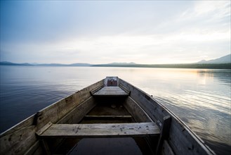 Dilapidated boat on remote lake