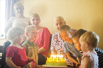 Caucasian multi-generation family celebrating birthday