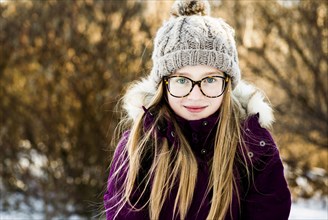 Caucasian girl smiling outdoors in winter