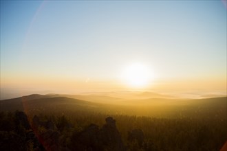 Sunrise over hills in remote landscape