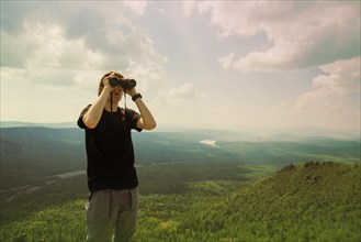 Caucasian hiker admiring remote landscape
