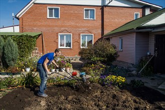 Caucasian man working in garden