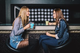 Women talking in coffee shop