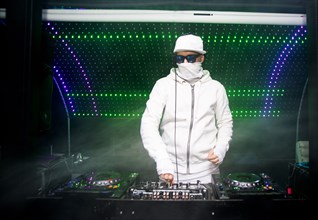 DJ playing music in nightclub