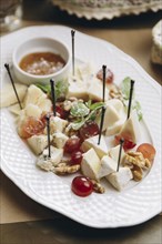 Cheese and fruit on plate