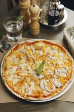 Gourmet pizza with chicken and peppers