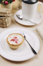 Tart on plate with fork
