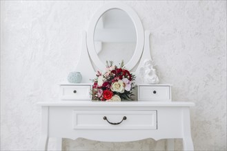 Bouquet of flowers on white vanity
