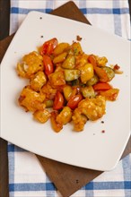 Orange chicken with tomatoes