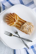 Pastry on plate with forks