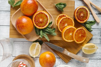 Sliced oranges on cutting board