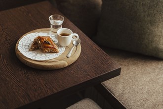 Espresso and dessert on cutting board