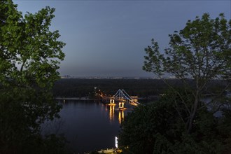 Scenic view of bridge over river at night