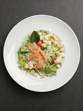 Seafood salad with cheese and croutons