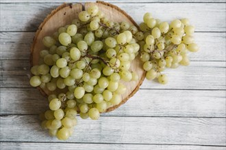 Green grapes on cutting board