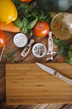 Ingredients for salad near cutting board