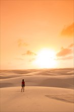 Mixed race teenage girl standing in remote desert