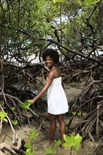 Black woman smiling in mangrove jungle