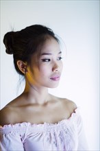 Portrait of pensive Asian woman
