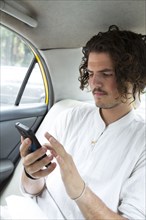 Passenger in car texting on cell phone