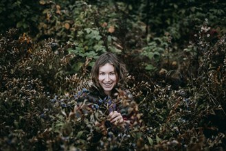 Caucasian woman smiling in bush