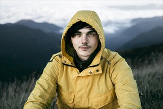 Portrait of Caucasian man in remote mountain landscape