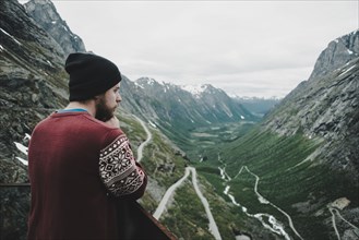 Caucasian man admiring scenic view of valley