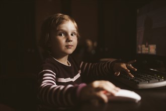 Caucasian boy using computer
