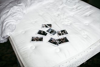 Photographs on bed mattress