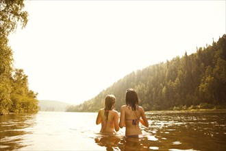 Girls standing together in lake