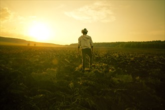 Mari man standing in rural field