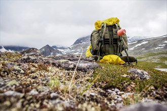 Backpack in mountain field