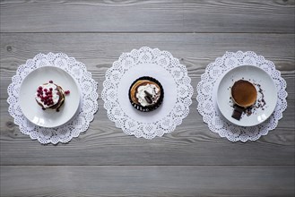 Plates of dessert on lace doilies