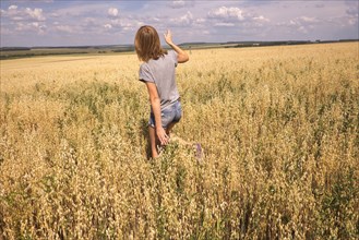 Caucasian woman walking in field