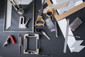Picture frame and tools on table