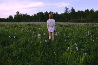 Woman walking in field