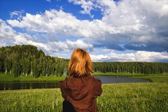 Woman admiring scenic view of river