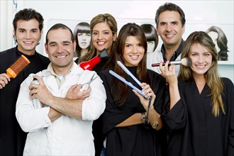 Hispanic clients and stylists in beauty salon