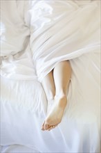 Woman's feet in bed