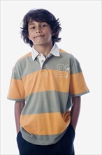 Hispanic boy with hands in pockets