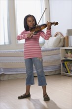 African American girl playing violin