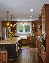 Hardwood floors and cabinets in kitchen