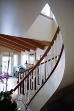 Contemporary curved staircase in home