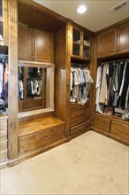 Large wooden walk in closet