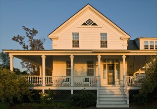 Front exterior traditional home with wrap around porch