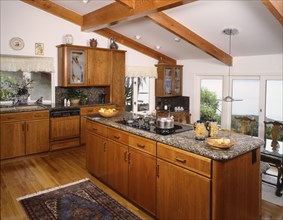Kitchen with hardwood floor and pitched ceiling